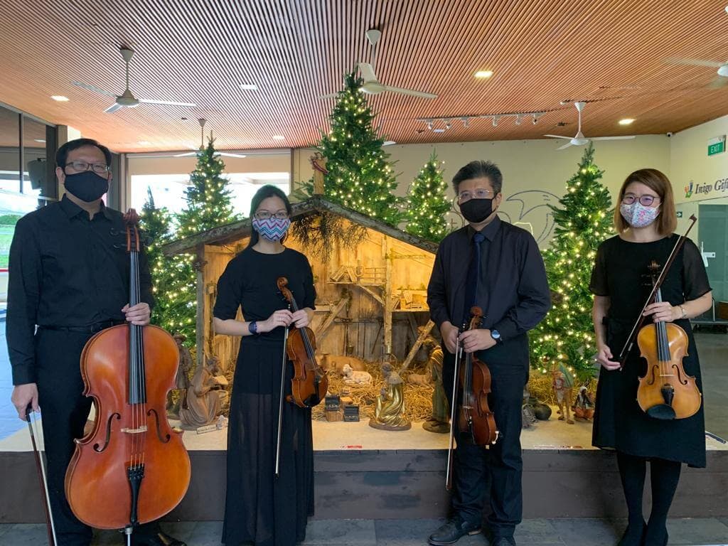 Musicians with cello and violins at a Christmas performance