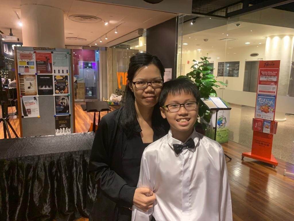 Elaine with a young violin student at a school event