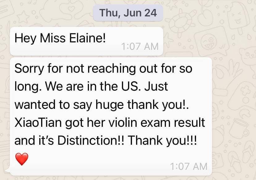 WhatsApp message from a parent reporting their daughter passed her violin exam with Distinction